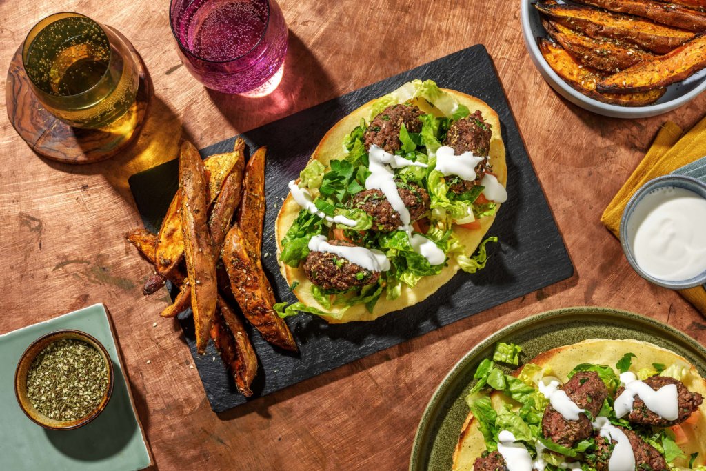 Lamb Kofta Kebabs on Garlic Naans with Zahtar Sweet Potato Wedges, Baby Gem Salad and Yoghurt