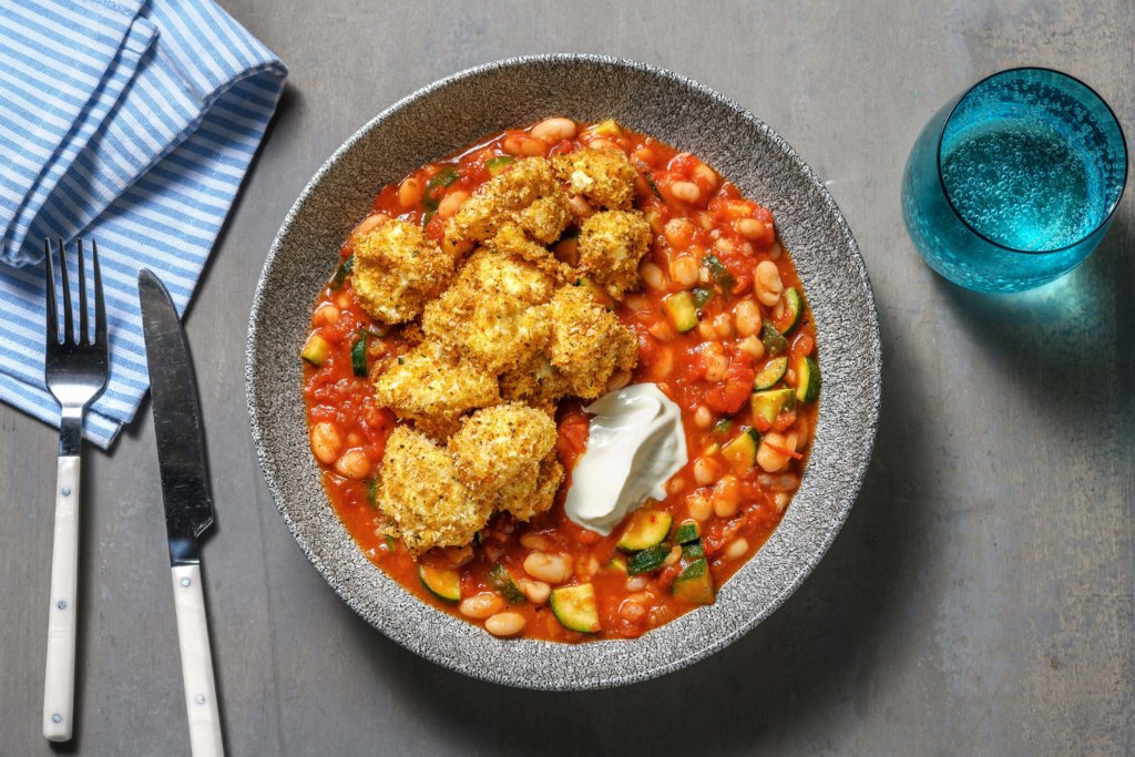 Crispy Cauliflower Nuggets with Spicy Bean Stew and Soured Cream,