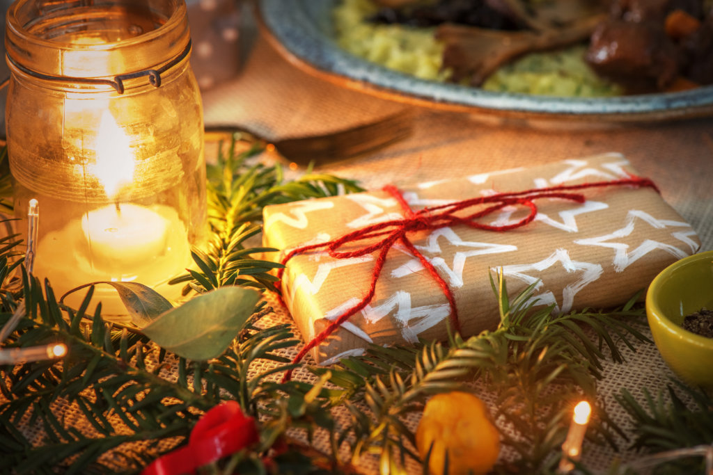 Christmas present image with foliage and candles