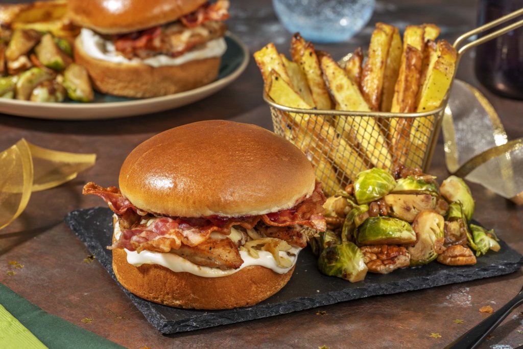Festive Cheesy Bacon Chicken Burger with Redcurrant Jelly, Handcut Chips and Glazed Pecan Sprouts