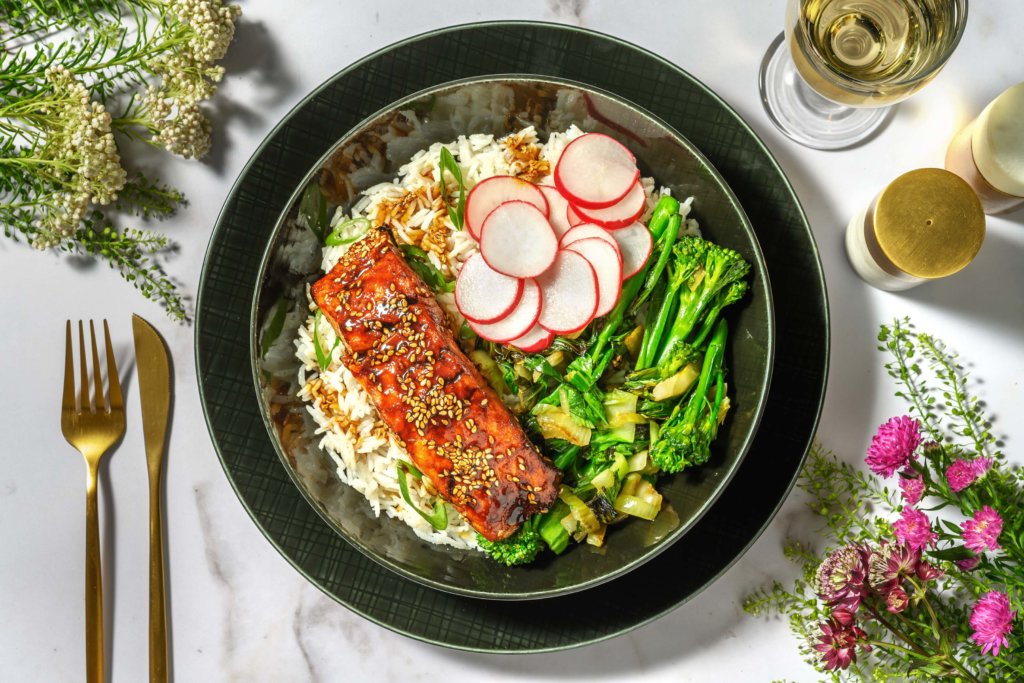 Sweet and Spicy Sriracha Salmon and Pak Choi Rice Bowl with Pickled Radish and Ginger and Spring Onion Rice.