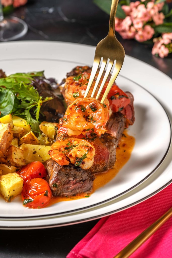 Valentine's Day Fillet Steak Surf and Turf with Tomato-Garlic King Prawns, Herby Roast Potatoes and Salad recipe image