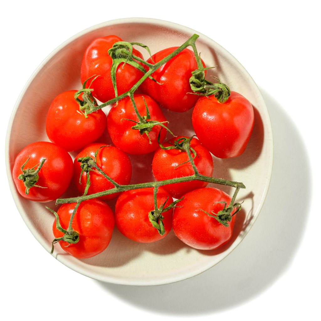 tomatoes on vine in a bowl image uk