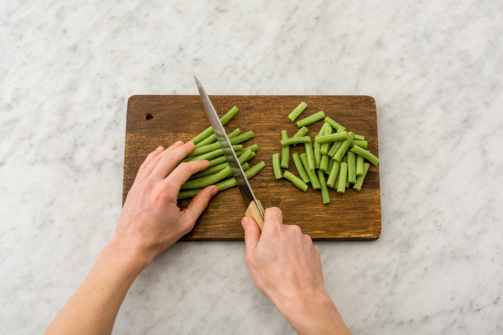 green beans chopped on chopping board uk